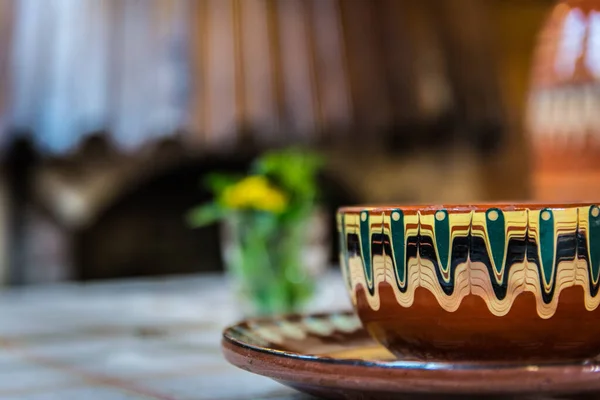 Old hand crafted bowl on the table.