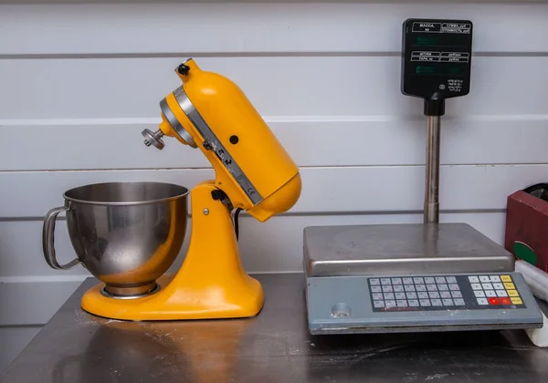 mixer, dough mixer: cutting table, chicken legs, shooting various types of kitchen equipment for a restauran