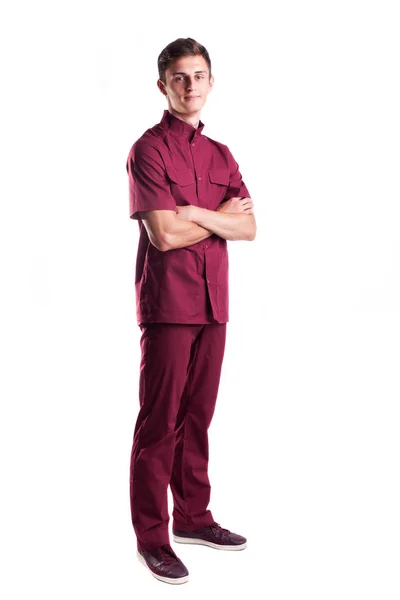 Guapo médico en uniforme rojo aislado — Foto de Stock