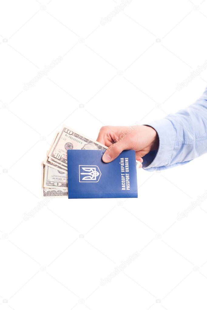 Passport with money in hand isolated