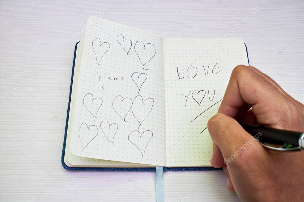 notebook with love notes on white table