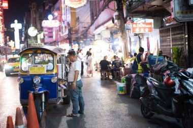 BANGKOK, THAILAND - may 4:Unidentified male driver of Tuk Tuk or 3-wheeled taxi,waiting passenger to trips tour at china town on may 4 2019