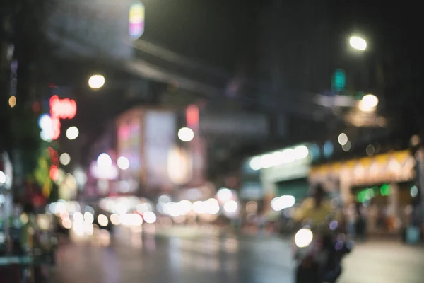 blurred night market festival people walking on road