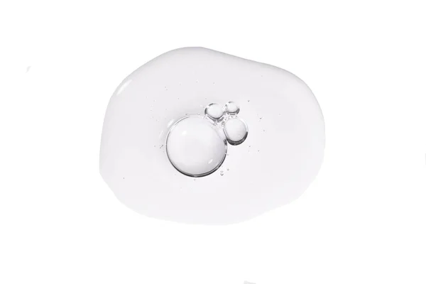 Kolajen ve peptit içeren serum. Beyaz arka planda baloncuklu cilt bakımı jeli örneği. Emülsiyon dokusu. Güzellik kozmetik ürün kataloğu.