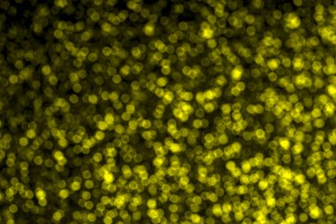 Parlak sarı yüzey, ışık efektiyle. Bokeh örtülü efekt için ışığı söndürdü. Bulanık odaklı ışık. Şenlikli arka plan. Parlak tatil partisi dekorasyonu. Sihirli ışıklar.. .