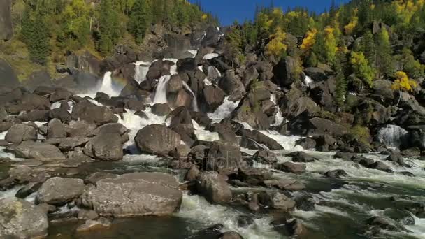 Aerial view of waterfall, flying over autumn forest, waterfall with big stones — Stock Video