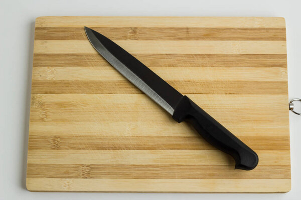 With knife on chopping board,top view.