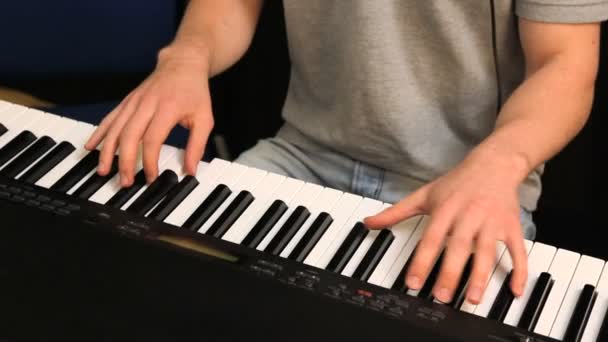 Young Male playing on piano — Stock Video