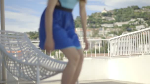 Woman sitting on outdoor chair — Stock Video