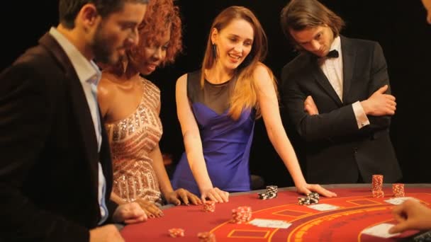 Players Gambling in the Casino — стоковое видео' data-src='https://st3.depositphotos.com/3599713/12581/v/600/depositphotos_125810982-stock-video-players-gambling-in-the-casino.jpg