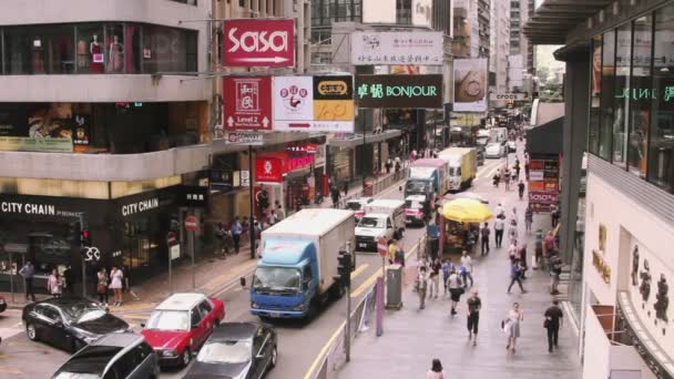 View of city with shops and people walking — Stock Video