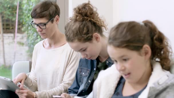 Mom with daughters using devices — Stock Video