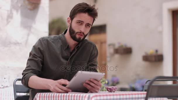 Young adult male using digital tablet — Stock Video