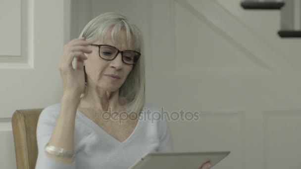 Senior adult female reading — Stock Video