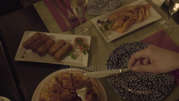 Young adult woman eating tapas in restaurant — Stock Video