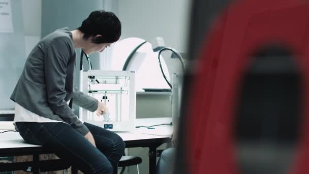 Designers looking at 3d printed object — Stock Video