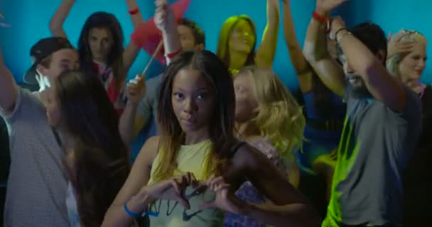 Woman Showing Heart Shape Symbol While Dancing Friends Nightclub — Stock Video