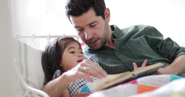 Father Reading Daughter Bedtime Story — Stock Video