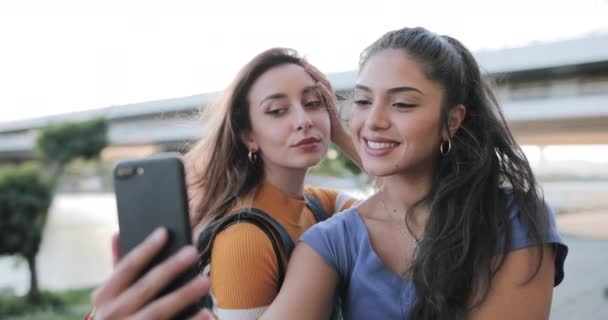 Girlfriends Take A Selfie at waterfront at sunset in summer. — Vídeos de Stock