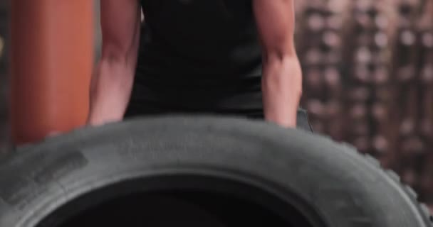 Adult male flipping tire for a body building workout — Stock Video