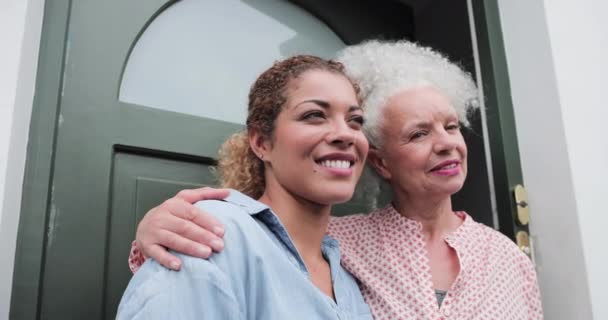 Portrait of senior female with daughter outside home — Stock Video