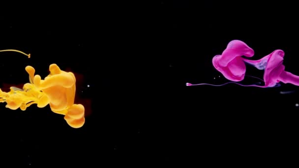 Pink Yellow Ink Paint Drops Water Mixing — Stock Video