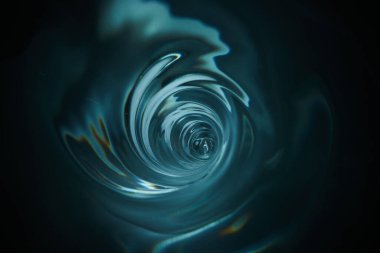 Pürüzsüz ve güzel mavi girdap. Girdap, su girdabı, üst manzara. Yüksek hızlı sıvı fotoğrafçılık.