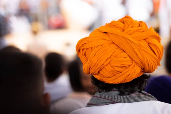 People lock down Panic In People in India Due to Corona Virus Color of Rajasthan . Rajasthani Guy wearing orange safa in Crowd.