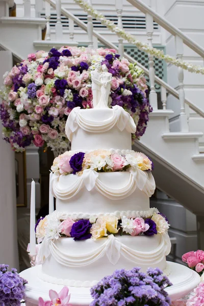 a white vintage wedding cake