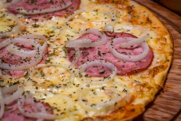 pizza with ham and onion.