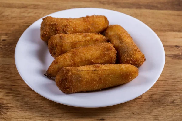 Delicious Fried Breaded Bananas Wooden Background — Stock Photo, Image