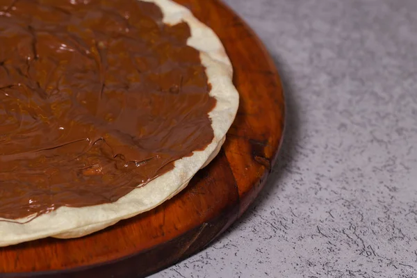 chocolate pizza on gray background