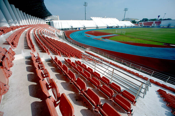 Colorful of stadium seats in background.