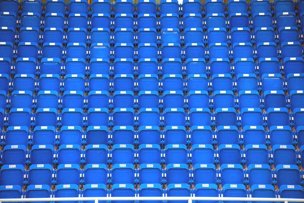 Kleurrijke stadion zitplaatsen op achtergrond. — Stockfoto