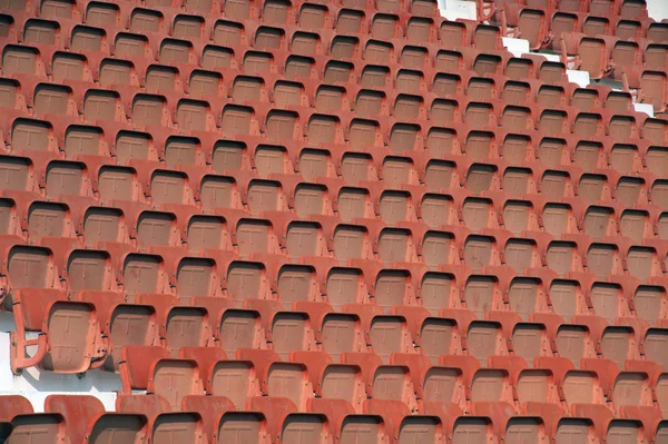 Colorido de asientos de estadio en el fondo . — Foto de Stock