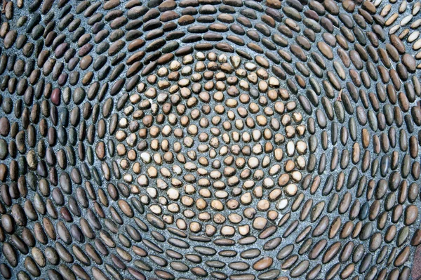 Pebbles stenen patroon op de vloer voor voetmassage. — Stockfoto