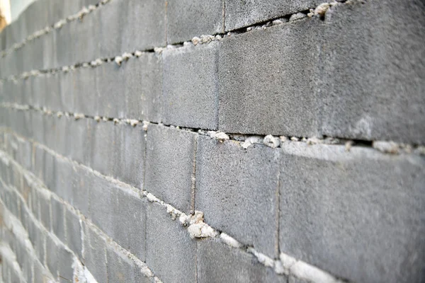 Fondo de textura de pared gris para antigua pared de ladrillo gris superficie rugosa. Muro de ladrillo como fondo para el concepto . — Foto de Stock