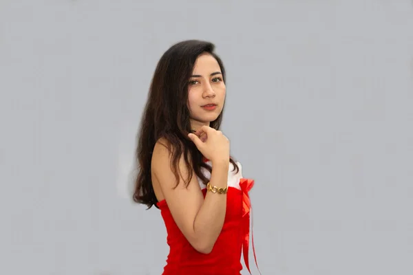 Beautiful Asian woman dressed in red in a Santa outfit. Standing and smiling at Christmas And act in different ways. — 스톡 사진