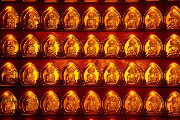 Many small golden Gods shaped coins decorated with pillars in Chinese shrines in Thailand. — Φωτογραφία Αρχείου