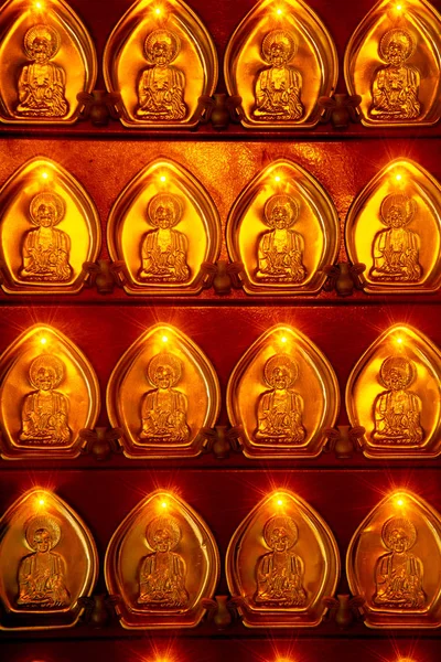 Many small golden Gods shaped coins decorated with pillars in Chinese shrines in Thailand. — Stock Photo, Image