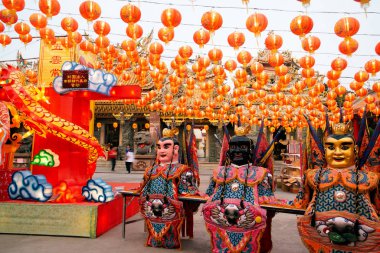 Original red lanterns in the blue sky and Godness lamp at evening at the Chinese New Year Celebration. Year Lantern Festival.