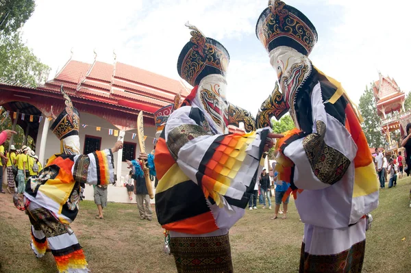 LOEI, THAILAND - JUNE 23, 2012 : Phi Ta Khon Festival ( Traditional ghost mask festival ) Young people dress in spirit and wear a mask, sing and dance on June 23,2012 in Loei. Province,Thailand.