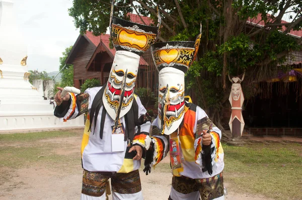 LOEI, THAILAND - JUNE 23, 2012 : Phi Ta Khon Festival ( Traditional ghost mask festival ) Young people dress in spirit and wear a mask, sing and dance on June 23,2012 in Loei. Province,Thailand.