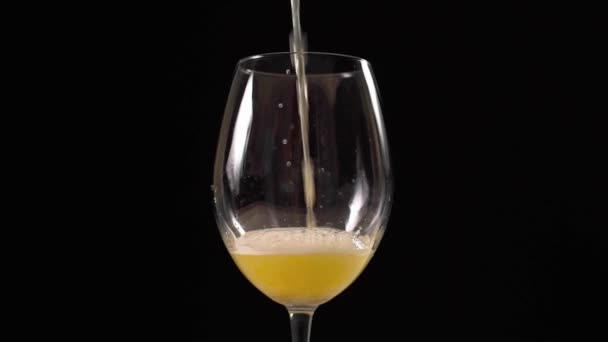 Shot of golden foamy craft beer is poured to the glass — Stock Video