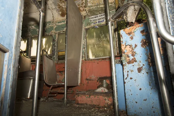 Colorful seats of abandoned trolley car