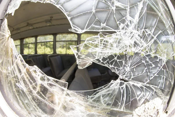 Broke safety glass on bus