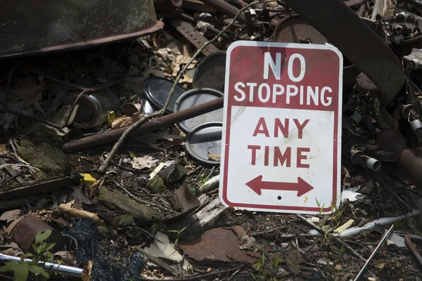 No stopping sign on trash