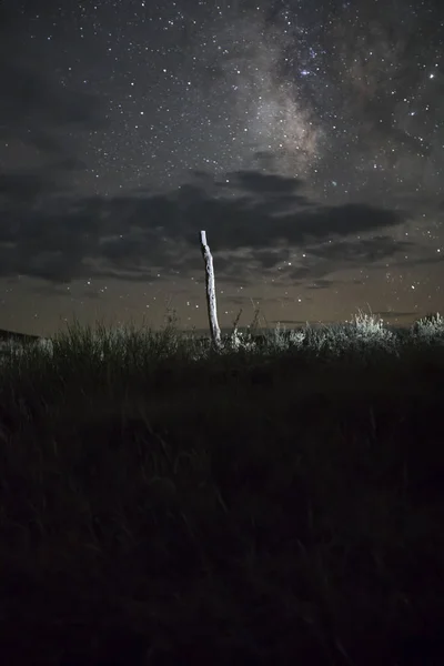 Fence post against Milky Way