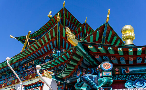 Beautifully ornamented and incredibly detailed and precise roof of the beautiful colorful temple and stupas in Ivolginsky Datsan, russian centre of Buddhism near Ulan Ude, Buryatia, Central Asia