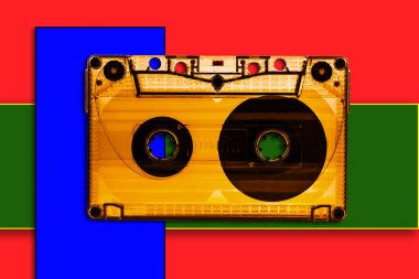 Picture of a musical cassette on a colorful background clipart